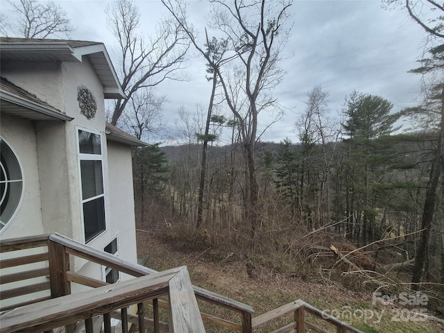 view of yard with a view of trees