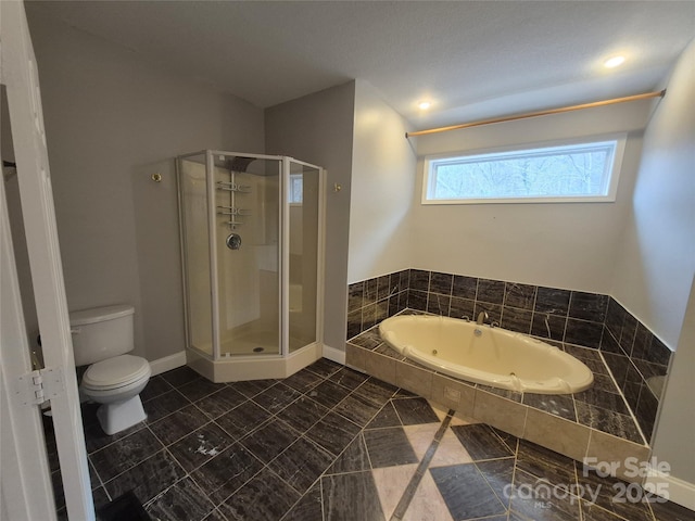 full bathroom featuring a whirlpool tub, a shower stall, toilet, and baseboards