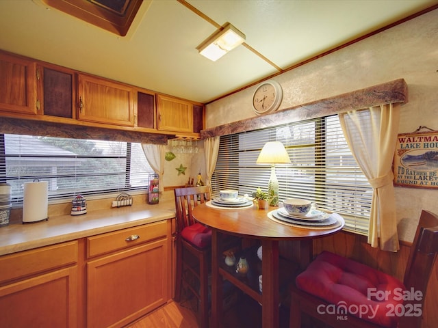 kitchen featuring brown cabinets, light countertops, and light wood-style floors