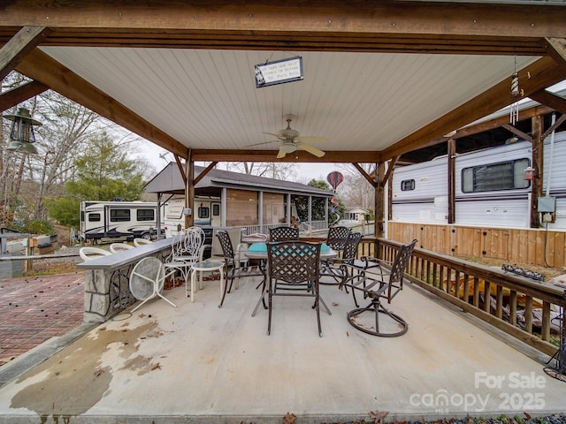 view of patio / terrace featuring outdoor dining area and ceiling fan