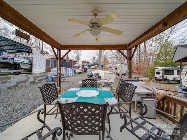 view of patio featuring ceiling fan and outdoor dining area