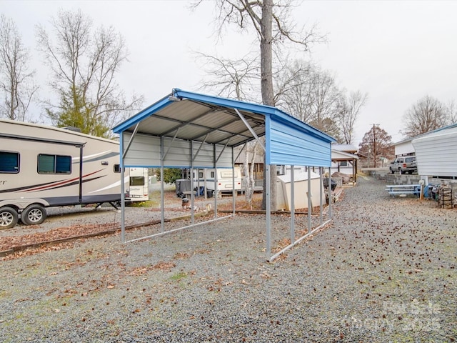 view of vehicle parking with a detached carport