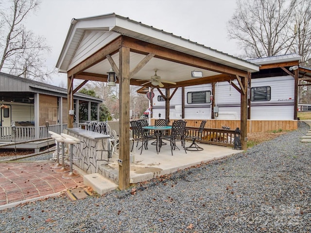 view of patio / terrace featuring a ceiling fan and outdoor dining space