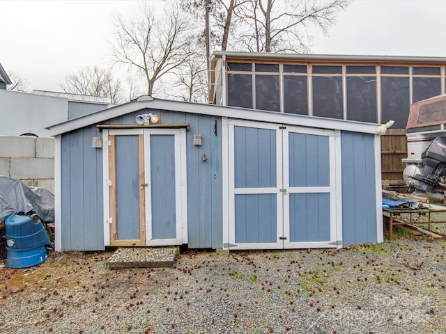 view of shed with fence