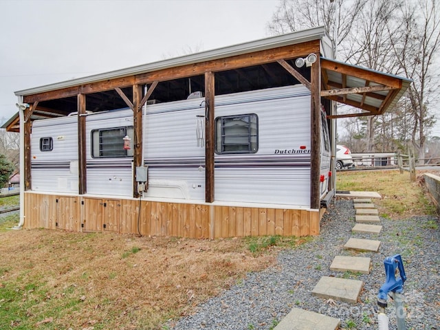 exterior space with a detached carport