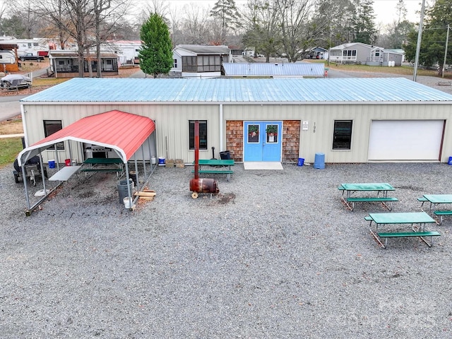 exterior space with metal roof and board and batten siding