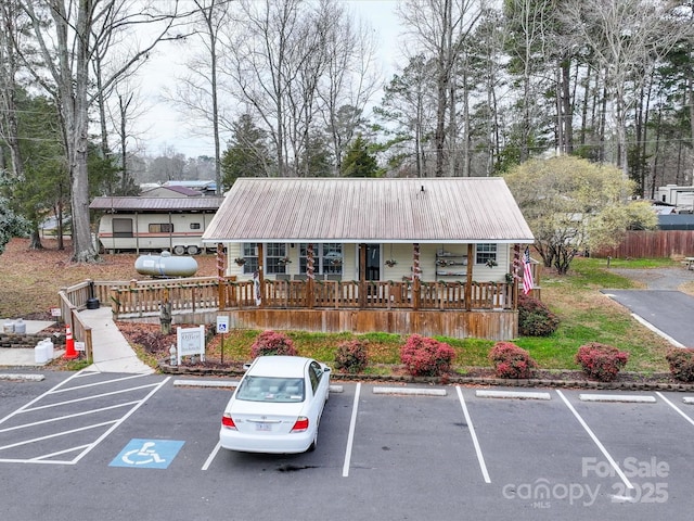 view of property with uncovered parking