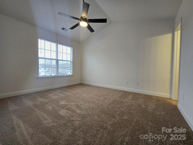 carpeted spare room with a ceiling fan, lofted ceiling, visible vents, and baseboards