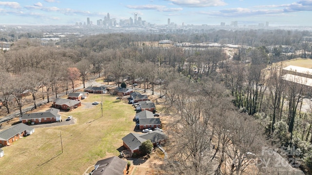 birds eye view of property with a view of city