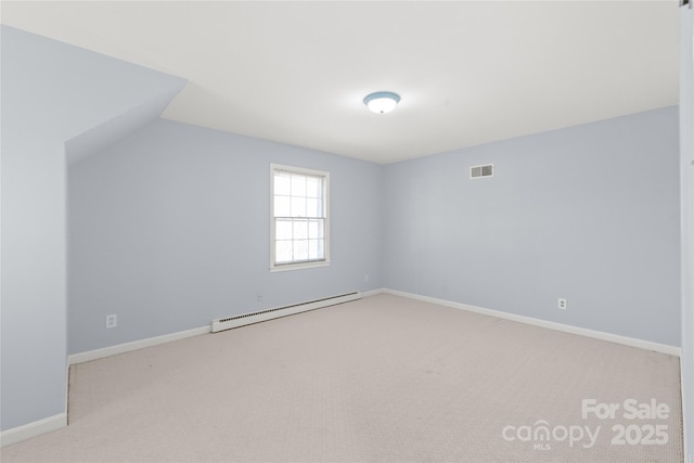 interior space with visible vents, light carpet, lofted ceiling, baseboards, and baseboard heating