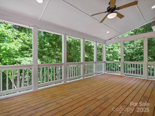 wooden terrace featuring a ceiling fan