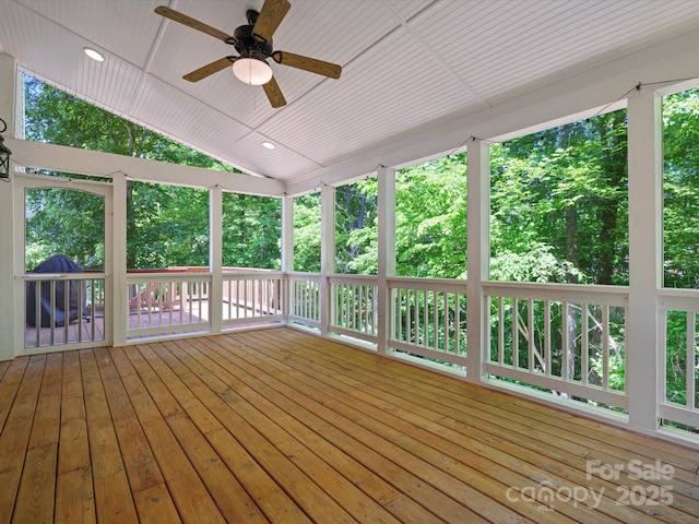 wooden terrace featuring a ceiling fan
