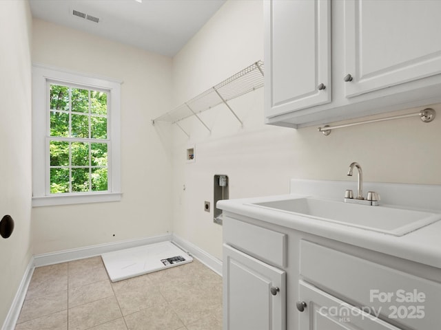 laundry area with visible vents, cabinet space, a sink, washer hookup, and hookup for an electric dryer