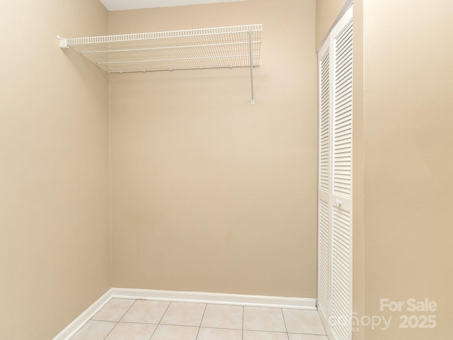 spacious closet with light tile patterned flooring