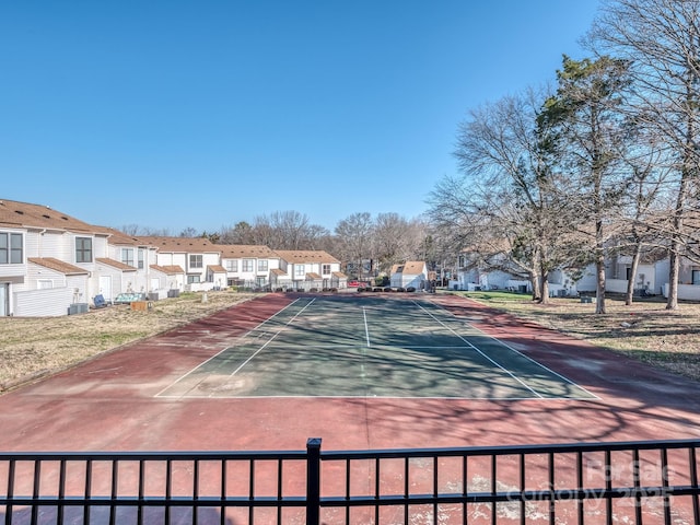 view of sport court with a residential view