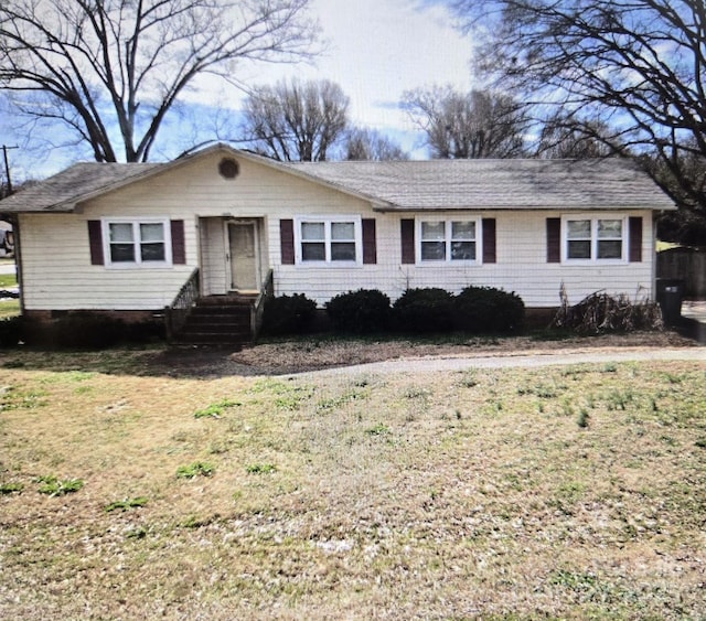 ranch-style house with a front yard