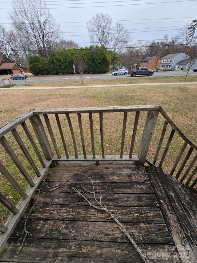 wooden deck with a yard