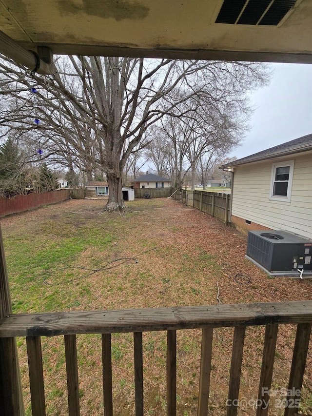 view of yard with cooling unit, visible vents, and a fenced backyard