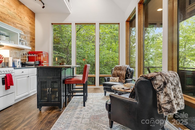 interior space featuring dark countertops, electric stove, dark wood-style floors, white cabinetry, and open shelves