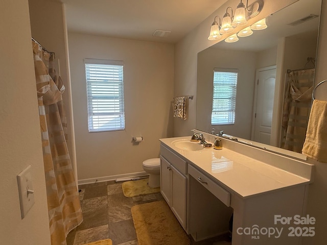 full bath with toilet, baseboards, visible vents, and vanity