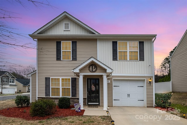 1301 Waylon Ave, Gastonia, NC 28054 - traditional home with an attached garage, driveway, fence, and board and batten siding