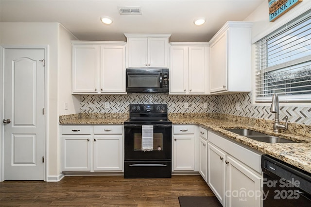 1301 Waylon Ave, Gastonia, NC 28054 - kitchen featuring black appliances, a sink, white cabinetry, decorative backsplash, and recessed lighting