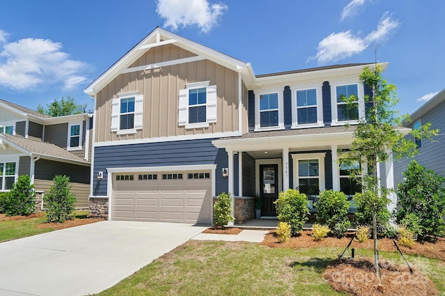 9843 Quercus Ln, Huntersville, NC 28078 - view of front facade with board and batten siding, concrete driveway, an attached garage, a porch, and stone siding