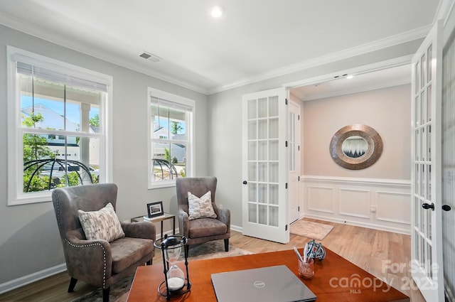 9843 Quercus Ln, Huntersville, NC 28078 - living area featuring french doors, wood finished floors, and crown molding