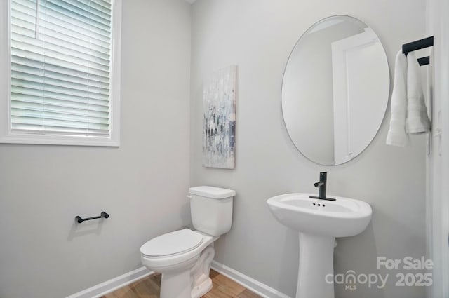 9843 Quercus Ln, Huntersville, NC 28078 - bathroom with baseboards, wood finished floors, and toilet