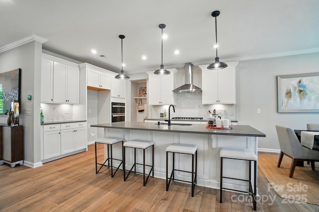 9843 Quercus Ln, Huntersville, NC 28078 - kitchen featuring wall chimney range hood, a sink, dark countertops, tasteful backsplash, and crown molding