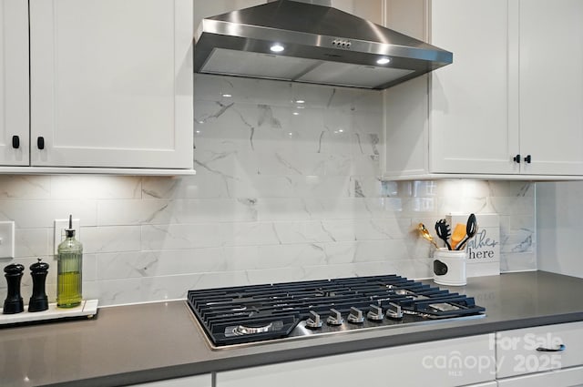 9843 Quercus Ln, Huntersville, NC 28078 - kitchen with range hood, white cabinets, backsplash, and stainless steel gas cooktop