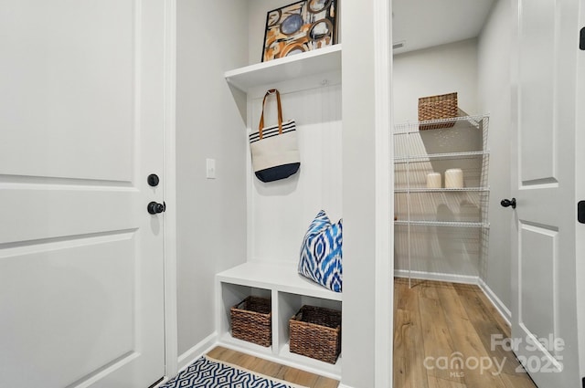 9843 Quercus Ln, Huntersville, NC 28078 - mudroom featuring wood finished floors and baseboards