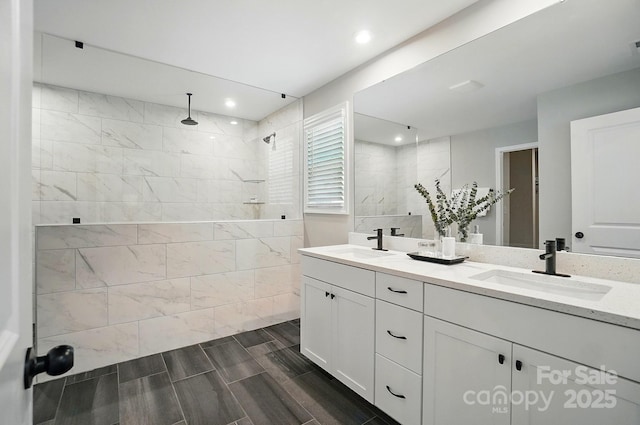 9843 Quercus Ln, Huntersville, NC 28078 - bathroom with double vanity, walk in shower, wood finish floors, and recessed lighting