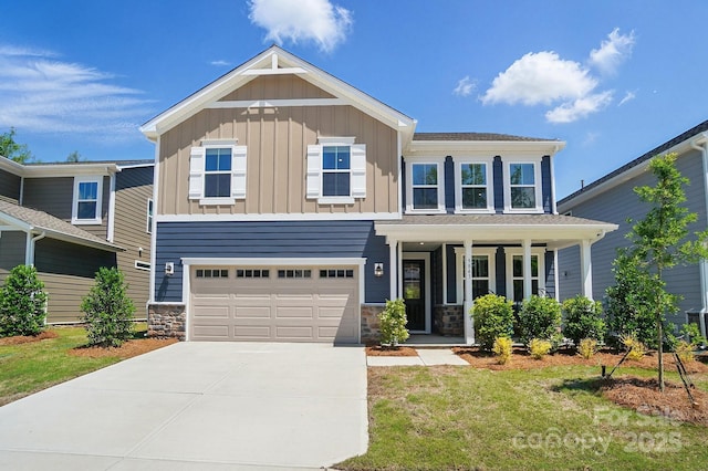 9843 Quercus Ln, Huntersville, NC 28078 - craftsman house with board and batten siding, driveway, a garage, a porch, and stone siding