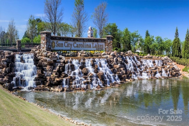 community sign with a water view