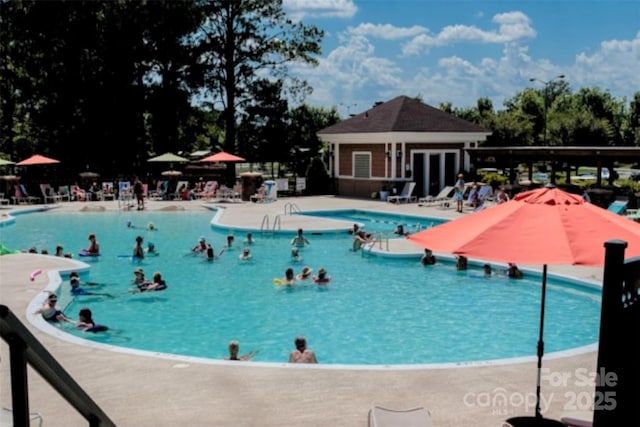 pool with a patio area