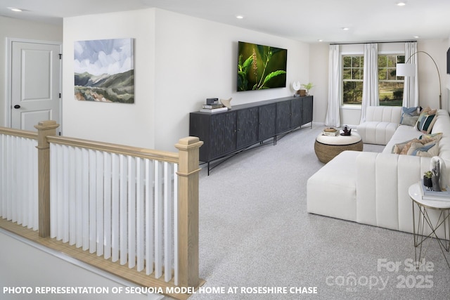 carpeted living area featuring recessed lighting