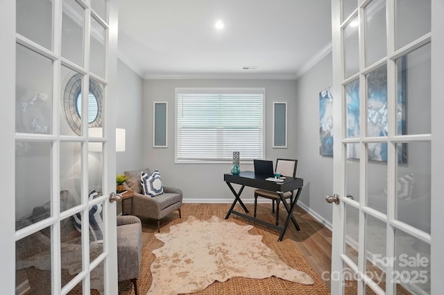 office featuring french doors, ornamental molding, baseboards, and wood finished floors