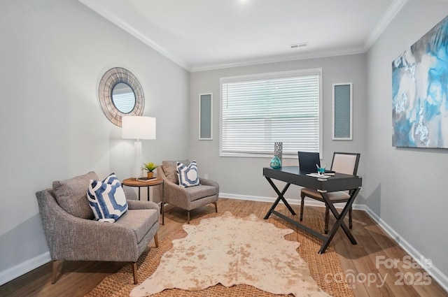office space featuring crown molding, wood finished floors, and visible vents