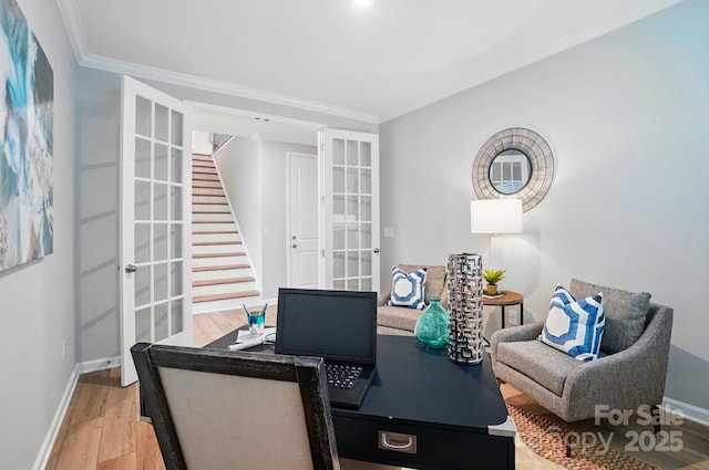 office featuring french doors, light wood-style flooring, crown molding, and baseboards
