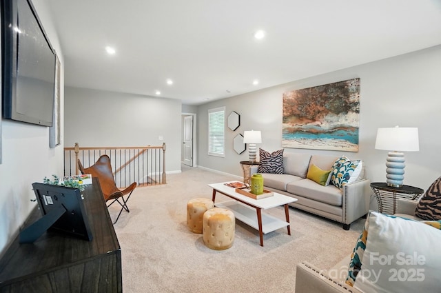 carpeted living room with recessed lighting and baseboards
