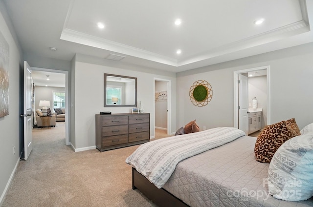 bedroom with a raised ceiling, recessed lighting, a spacious closet, and light colored carpet