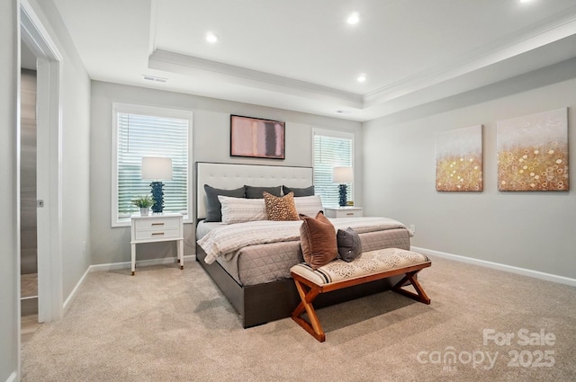 bedroom with crown molding, baseboards, light colored carpet, and a raised ceiling