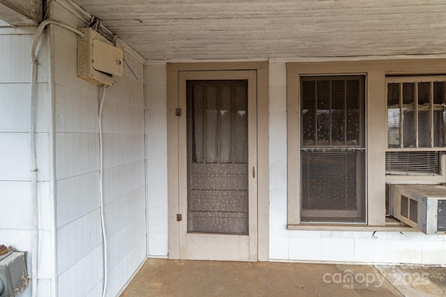 doorway to property featuring cooling unit