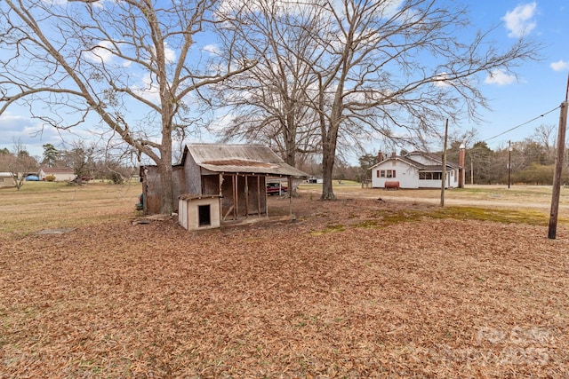 view of yard with an outbuilding and exterior structure