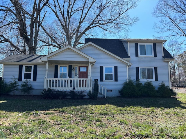 traditional-style home featuring crawl space, a porch, and a front lawn