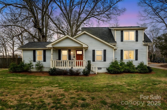 traditional home with a shingled roof, a front lawn, fence, a porch, and crawl space