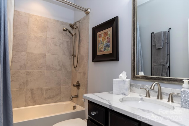 bathroom with toilet, shower / bath combination with curtain, and vanity