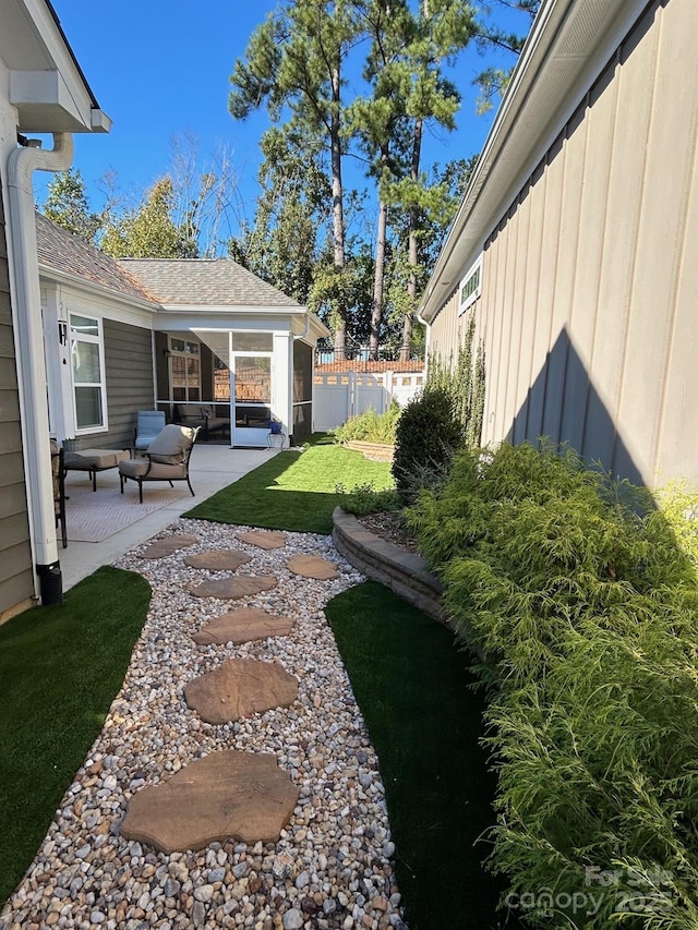 view of yard featuring a patio and fence