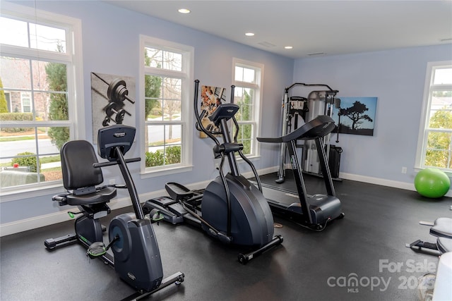 exercise area featuring recessed lighting and baseboards